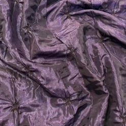 Belly Button (Pinwheel) Table Linen in Raisin