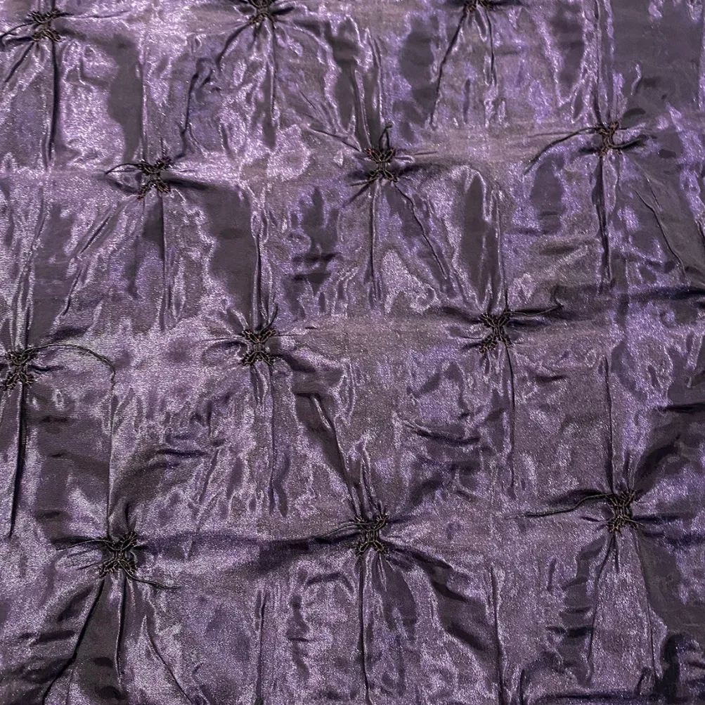 Belly Button (Pinwheel) Table Linen in Raisin
