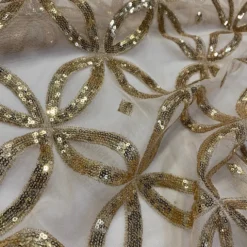 Delano Sequins Table Linen in Champagne