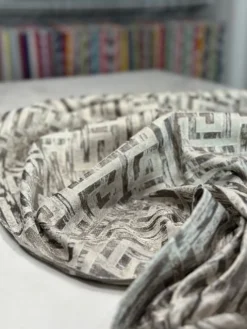 Gio Jacquard Table Linen in Taupe