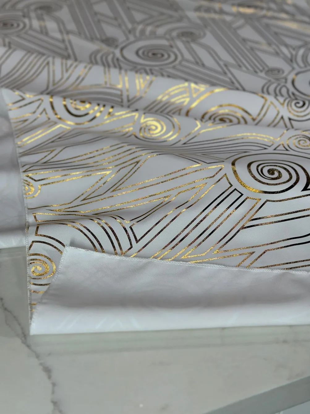 Luxor (Metallic Print) Table Linen in White and Gold