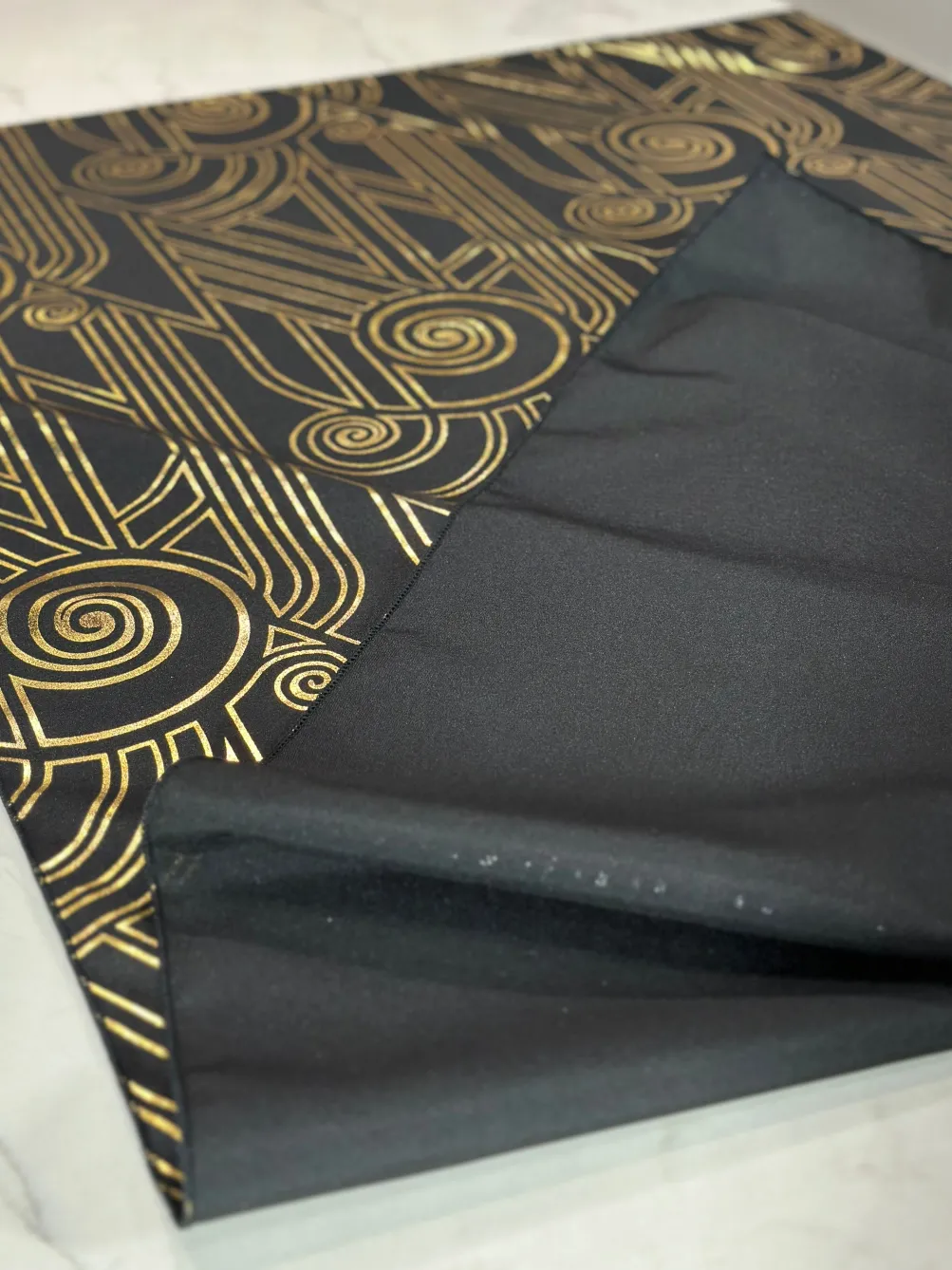 Luxor (Metallic Print) Table Linen in Black and Gold